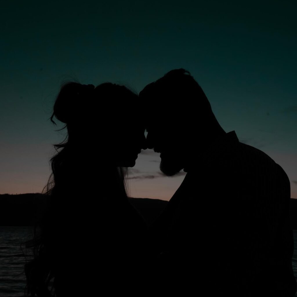 Couple silhouette with foreheads touching at sunset, romantic couple shoot Kelowna