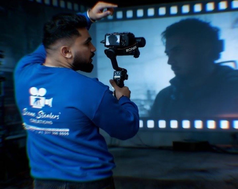 Jashan Rajeana, founder of Scene Stealers Creations, filming with a gimbal camera in Kelowna
