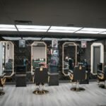High Fade Barbers shop interior with styling chairs and mirrors, business photography